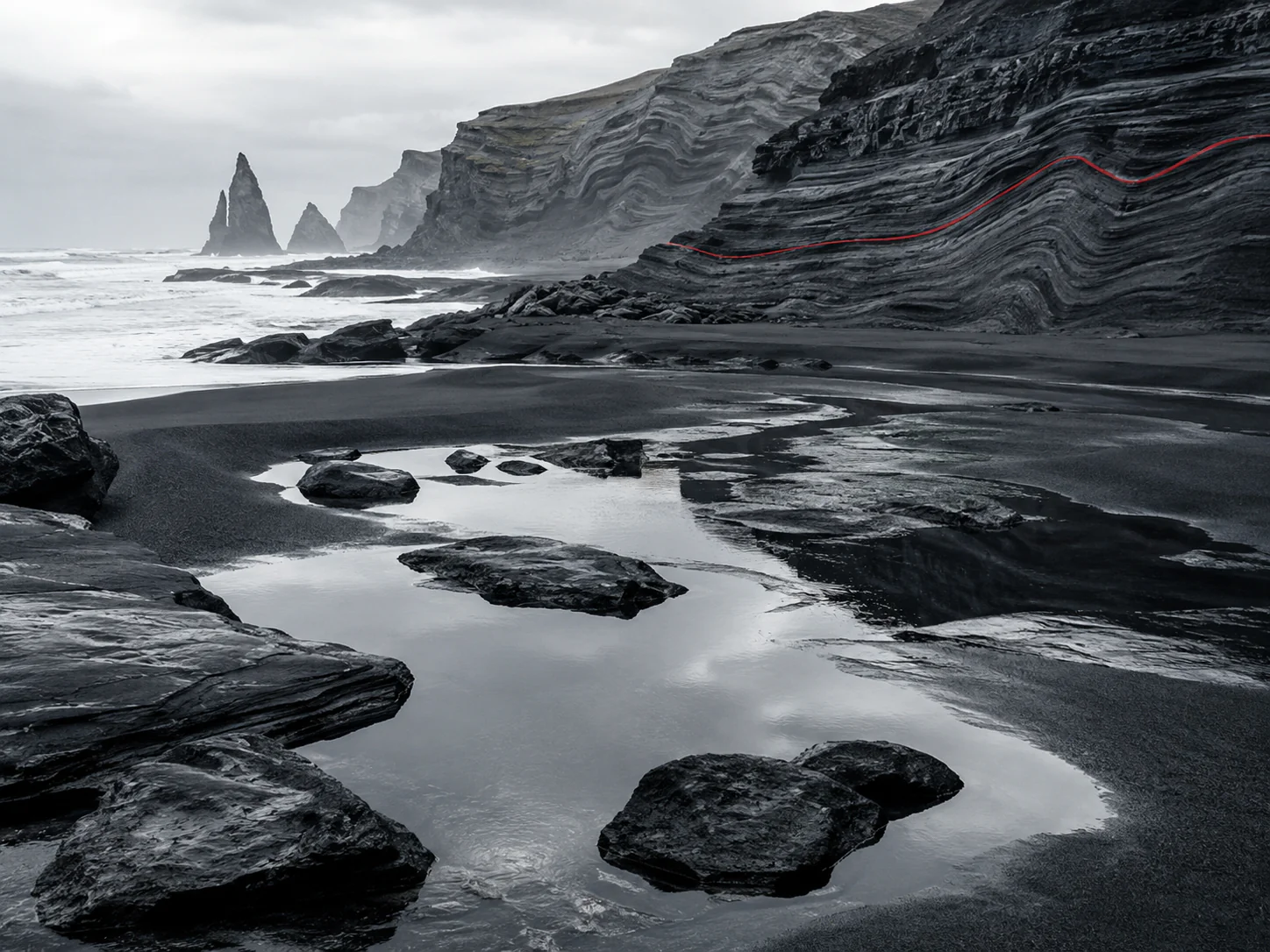 Black sand tidal pools sea stacks